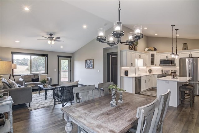 232 Chestnut St, Ellsworth, WI 54011 - dining area with dark wood finished floors, a ceiling fan, recessed lighting, a chandelier, and high vaulted ceiling