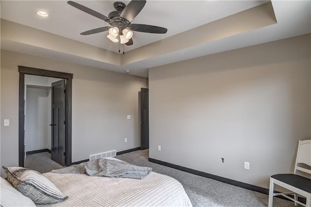 232 Chestnut St, Ellsworth, WI 54011 - carpeted bedroom featuring a raised ceiling, recessed lighting, and a ceiling fan