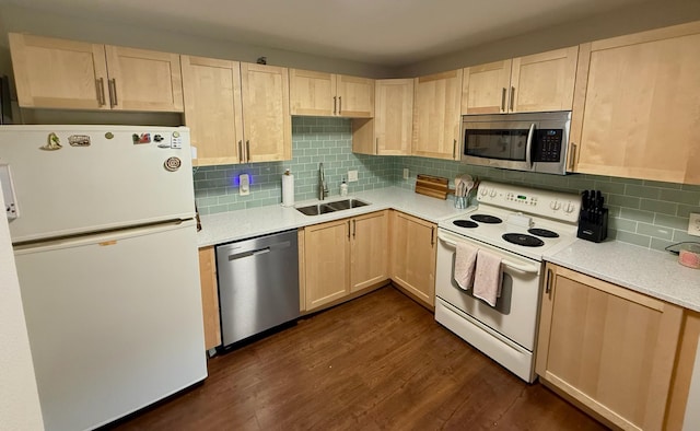 26 10th St W Unit 402, Saint Paul, MN 55102 - kitchen featuring appliances with stainless steel finishes, light brown cabinetry, light countertops, dark wood-type flooring, and tasteful backsplash