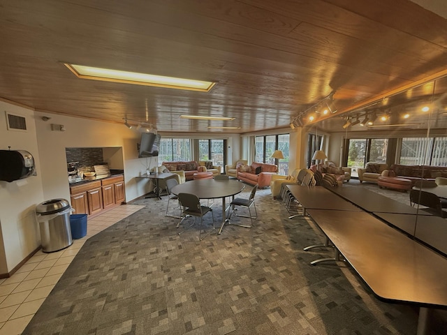 26 10th St W Unit 402, Saint Paul, MN 55102 - dining area with wooden ceiling, healthy amount of natural light, light tile patterned floors, and rail lighting
