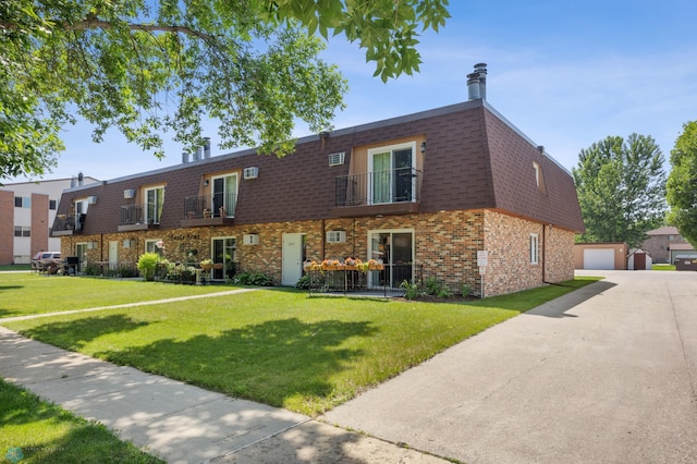 2575 Pacific Dr S Unit 301, Fargo, ND 58103 - view of property featuring a detached garage