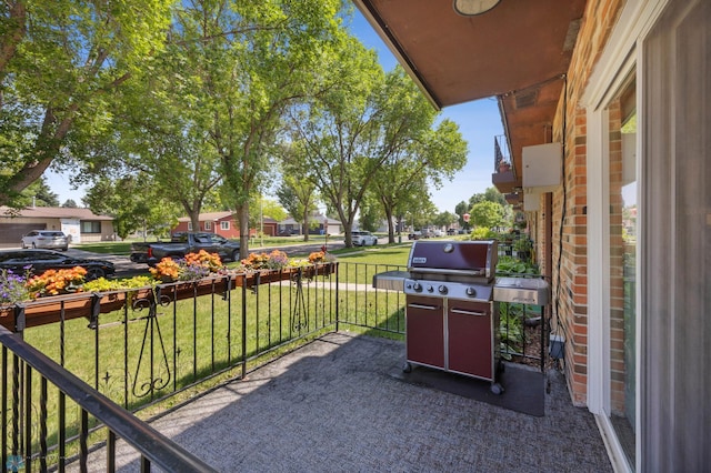 2575 Pacific Dr S Unit 301, Fargo, ND 58103 - view of patio / terrace featuring grilling area and a residential view