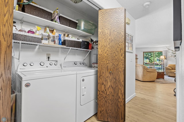 2575 Pacific Dr S Unit 301, Fargo, ND 58103 - laundry room with washing machine and dryer and light wood-type flooring