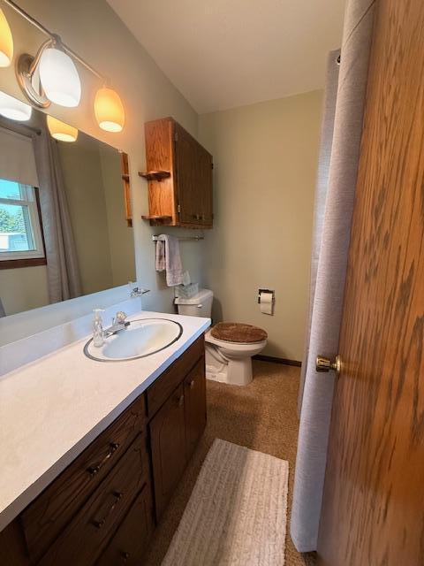2411 Douglas St, Windom, MN 56101 - bathroom with vanity and toilet