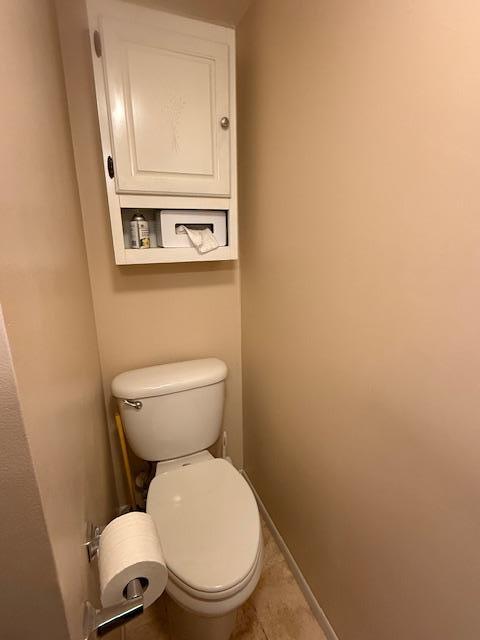 2411 Douglas St, Windom, MN 56101 - bathroom featuring toilet and tile patterned flooring