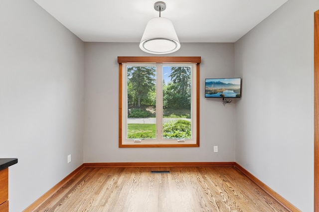 1775 Lexington Ave S Unit 26, Lilydale, MN 55118 - unfurnished room with light wood-style floors and baseboards
