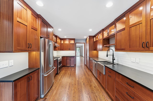 1775 Lexington Ave S Unit 26, Lilydale, MN 55118 - kitchen with appliances with stainless steel finishes, wood finished floors, dark countertops, recessed lighting, and glass insert cabinets
