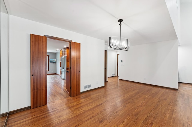 1775 Lexington Ave S Unit 26, Lilydale, MN 55118 - unfurnished dining area with a chandelier and wood finished floors