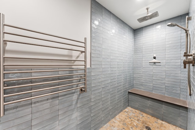 1775 Lexington Ave S Unit 26, Lilydale, MN 55118 - bathroom featuring radiator heating unit, tiled shower, and a towel warming rack