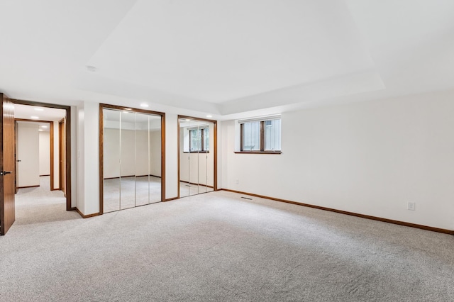 1775 Lexington Ave S Unit 26, Lilydale, MN 55118 - unfurnished bedroom featuring light carpet, two closets, and recessed lighting
