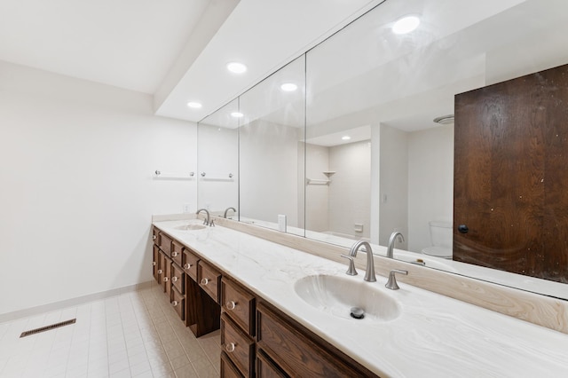 1775 Lexington Ave S Unit 26, Lilydale, MN 55118 - bathroom with double vanity, recessed lighting, walk in shower, and tile patterned floors