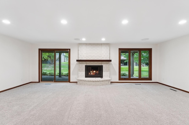 1775 Lexington Ave S Unit 26, Lilydale, MN 55118 - unfurnished living room with recessed lighting, a brick fireplace, and carpet