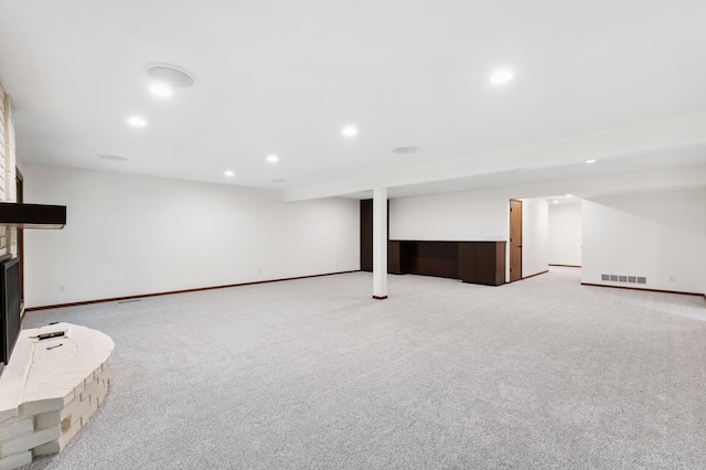 1775 Lexington Ave S Unit 26, Lilydale, MN 55118 - finished below grade area featuring light colored carpet, recessed lighting, and a large fireplace