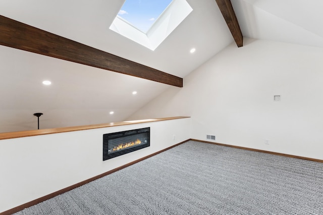 1775 Lexington Ave S Unit 26, Lilydale, MN 55118 - unfurnished living room featuring recessed lighting, carpet floors, a skylight, and a glass covered fireplace