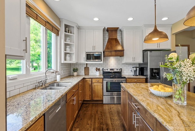 2227 Stone Creek Ln E, Chanhassen, MN 55317 - kitchen with appliances with stainless steel finishes, custom range hood, healthy amount of natural light, white cabinets, and recessed lighting