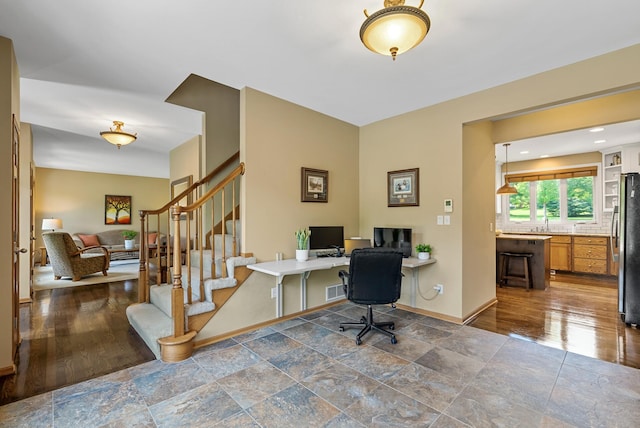 2227 Stone Creek Ln E, Chanhassen, MN 55317 - home office featuring dark stone finish flooring and baseboards