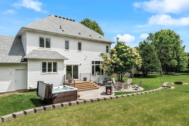 2227 Stone Creek Ln E, Chanhassen, MN 55317 - back of property featuring an outdoor fire pit, a patio area, roof with shingles, a hot tub, and a yard