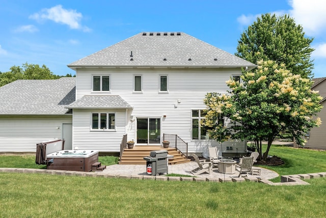 2227 Stone Creek Ln E, Chanhassen, MN 55317 - back of house with a fire pit, a patio, a yard, a shingled roof, and a deck
