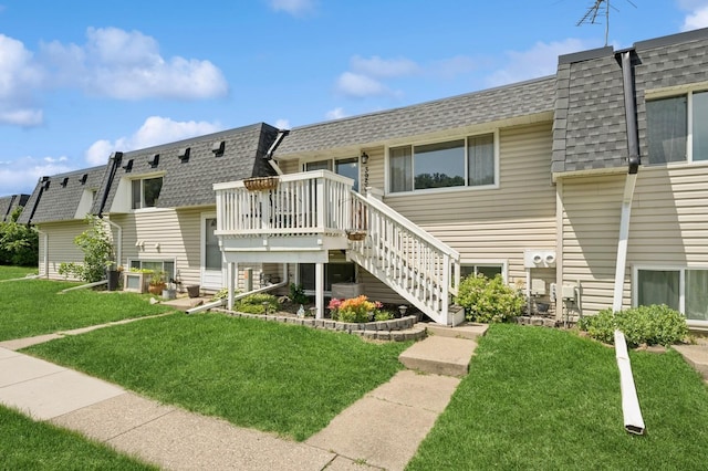 3950 Upper 75th St E, Inver Grove Heights, MN 55076 - rear view of house with a shingled roof, a yard, mansard roof, and a wooden deck
