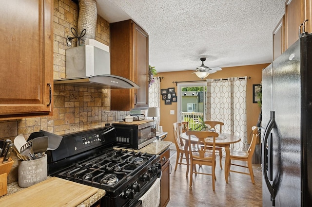 3950 Upper 75th St E, Inver Grove Heights, MN 55076 - kitchen featuring black appliances, brown cabinetry, backsplash, ceiling fan, and light countertops