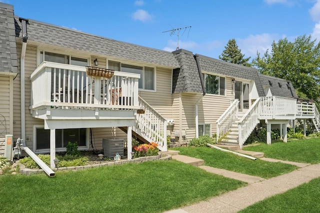 3950 Upper 75th St E, Inver Grove Heights, MN 55076 - rear view of property with stairway, a shingled roof, a wooden deck, mansard roof, and a yard