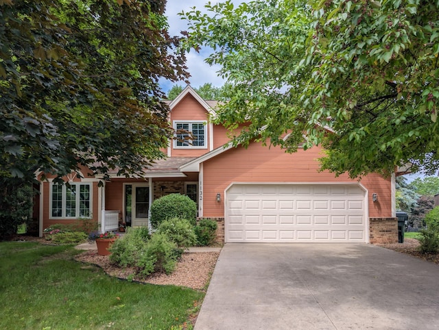 1132 Westbury Cir, Eagan, MN 55123 - obstructed view of property featuring driveway and a garage
