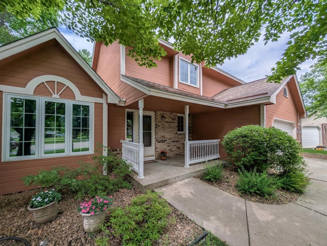 1132 Westbury Cir, Eagan, MN 55123 - traditional home with covered porch, an attached garage, and brick siding