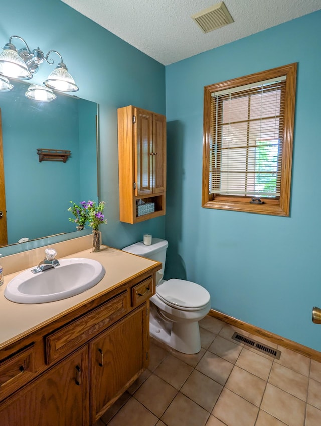 1132 Westbury Cir, Eagan, MN 55123 - half bath with a textured ceiling, vanity, and tile patterned floors