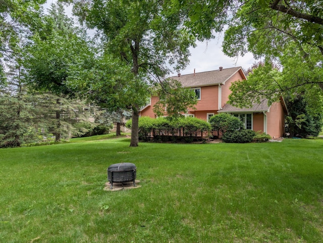1132 Westbury Cir, Eagan, MN 55123 - view of green lawn with a fire pit