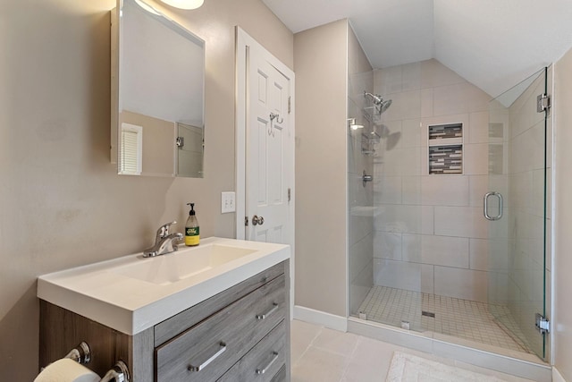 981 Bayless Ave, Saint Paul, MN 55114 - full bath with a stall shower, vanity, lofted ceiling, and tile patterned floors