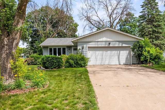 7795 Van Buren St NE, Spring Lake Park, MN 55432 - ranch-style house with a garage, concrete driveway, and a front lawn