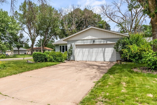 7795 Van Buren St NE, Spring Lake Park, MN 55432 - view of front of property featuring a front yard, a garage, and concrete driveway