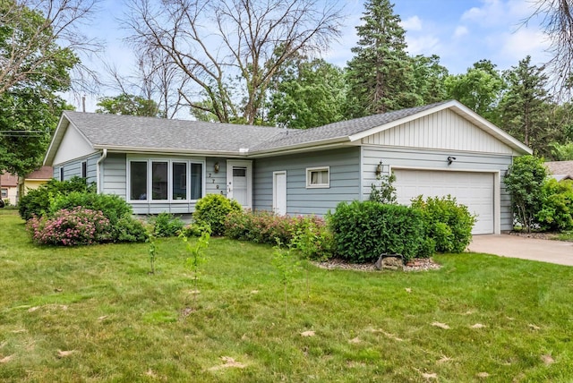 7795 Van Buren St NE, Spring Lake Park, MN 55432 - single story home with an attached garage, concrete driveway, a front lawn, and roof with shingles