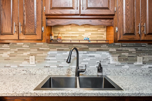 7795 Van Buren St NE, Spring Lake Park, MN 55432 - kitchen with backsplash and light stone counters