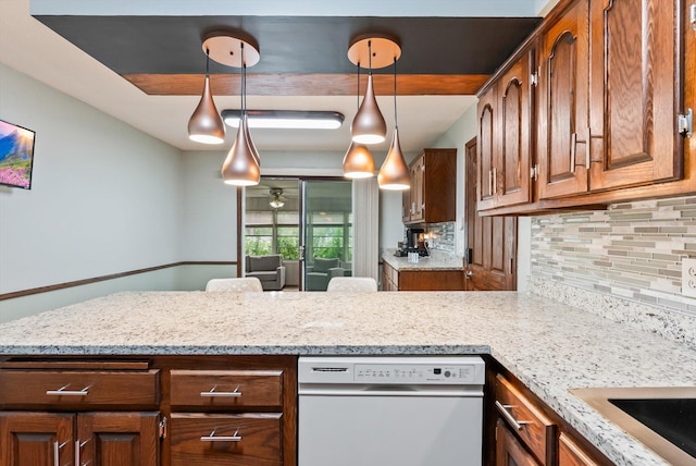 7795 Van Buren St NE, Spring Lake Park, MN 55432 - kitchen featuring dishwasher, decorative backsplash, a peninsula, brown cabinetry, and light stone countertops