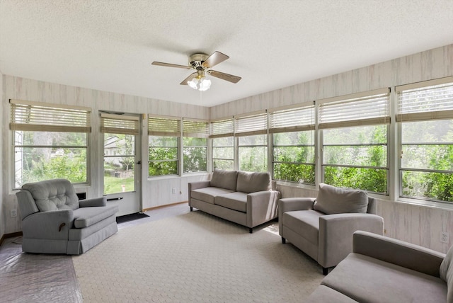 7795 Van Buren St NE, Spring Lake Park, MN 55432 - sunroom featuring a textured ceiling, plenty of natural light, and carpet