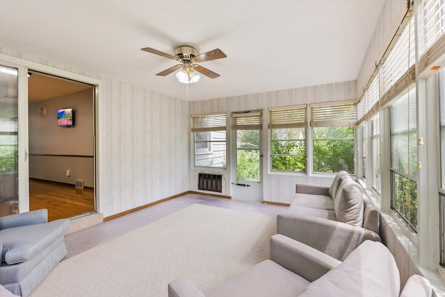 7795 Van Buren St NE, Spring Lake Park, MN 55432 - sunroom featuring wallpapered walls, carpet flooring, and heating unit