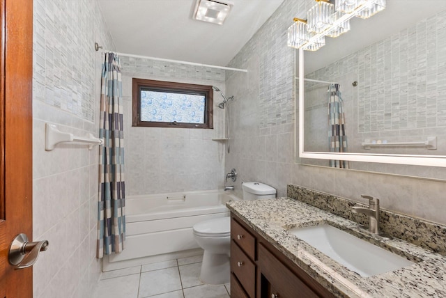 7795 Van Buren St NE, Spring Lake Park, MN 55432 - bathroom with tile walls, tile patterned flooring, vanity, and shower / bath combo