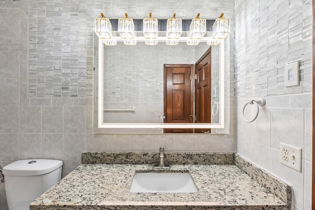 7795 Van Buren St NE, Spring Lake Park, MN 55432 - bathroom featuring vanity and tile walls