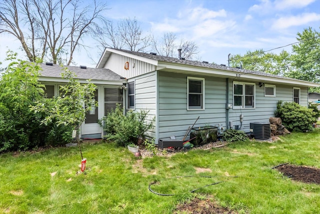 7795 Van Buren St NE, Spring Lake Park, MN 55432 - back of house featuring a yard and roof with shingles
