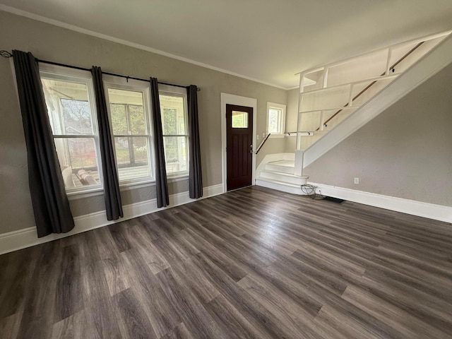 1678 Minnehaha Ave E, Saint Paul, MN 55106 - foyer featuring dark wood finished floors, stairway, and ornamental molding