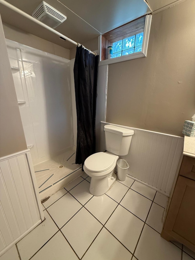 1678 Minnehaha Ave E, Saint Paul, MN 55106 - full bathroom with a wainscoted wall, a stall shower, vanity, and tile patterned flooring