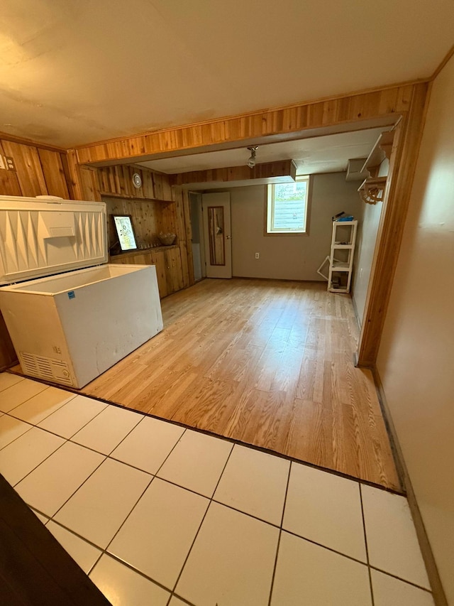 1678 Minnehaha Ave E, Saint Paul, MN 55106 - unfurnished living room featuring wood walls and wood finished floors