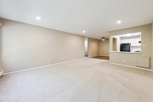 10311 Cedar Lake Rd Unit 210, Minnetonka, MN 55305 - unfurnished living room featuring light colored carpet and recessed lighting