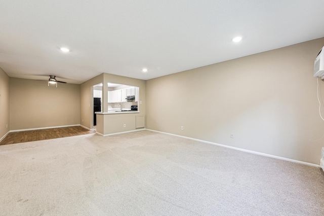 10311 Cedar Lake Rd Unit 210, Minnetonka, MN 55305 - unfurnished living room with light carpet, recessed lighting, and ceiling fan