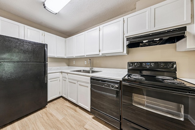 10311 Cedar Lake Rd Unit 210, Minnetonka, MN 55305 - kitchen with black appliances, exhaust hood, white cabinets, a textured ceiling, and light stone counters