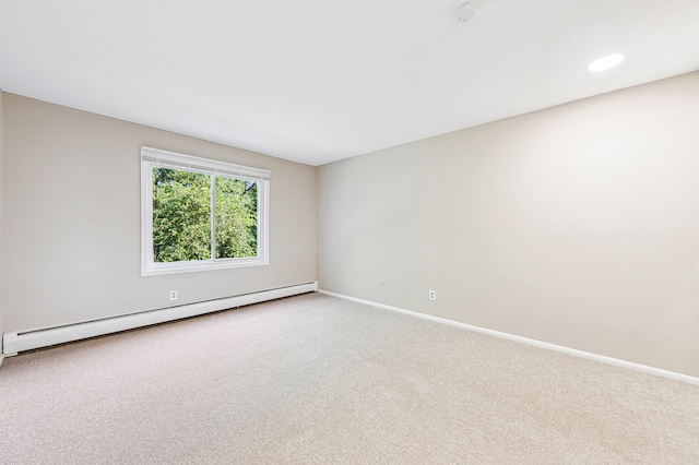 10311 Cedar Lake Rd Unit 210, Minnetonka, MN 55305 - carpeted empty room featuring a baseboard heating unit and baseboards