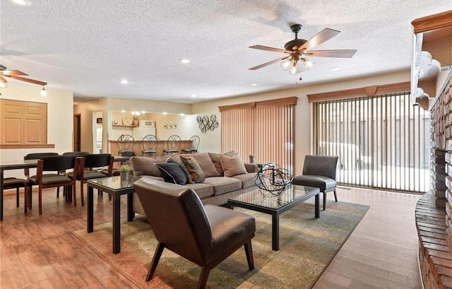 10311 Cedar Lake Rd Unit 210, Minnetonka, MN 55305 - living room featuring ceiling fan, a textured ceiling, wood finished floors, and recessed lighting