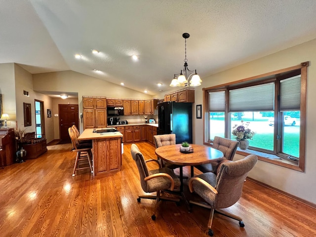 4095 125th St SE, Granite Falls, MN 56241 - dining area featuring light wood-style flooring, a chandelier, lofted ceiling, and recessed lighting