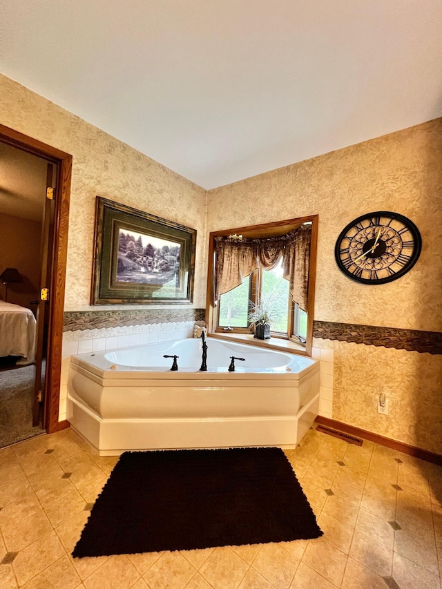 4095 125th St SE, Granite Falls, MN 56241 - ensuite bathroom with a bath, tile patterned floors, and wallpapered walls